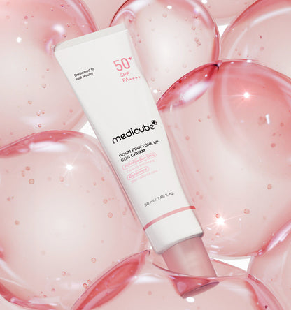 PDRN tone-up sun cream that brightens dull skin with a peachy-pink finish